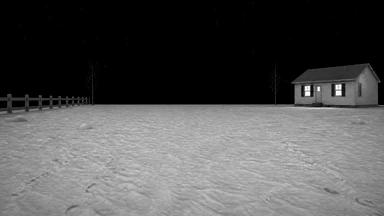 A snowy yard at night with a fence, two bare trees and a lit house